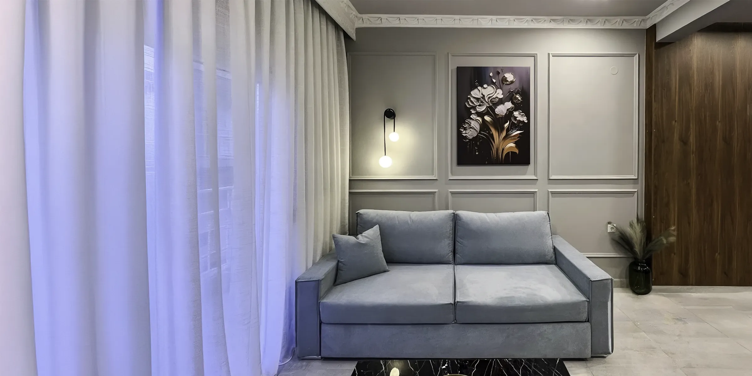 Warmly lit balcony with outdoor seating at Nido Blu